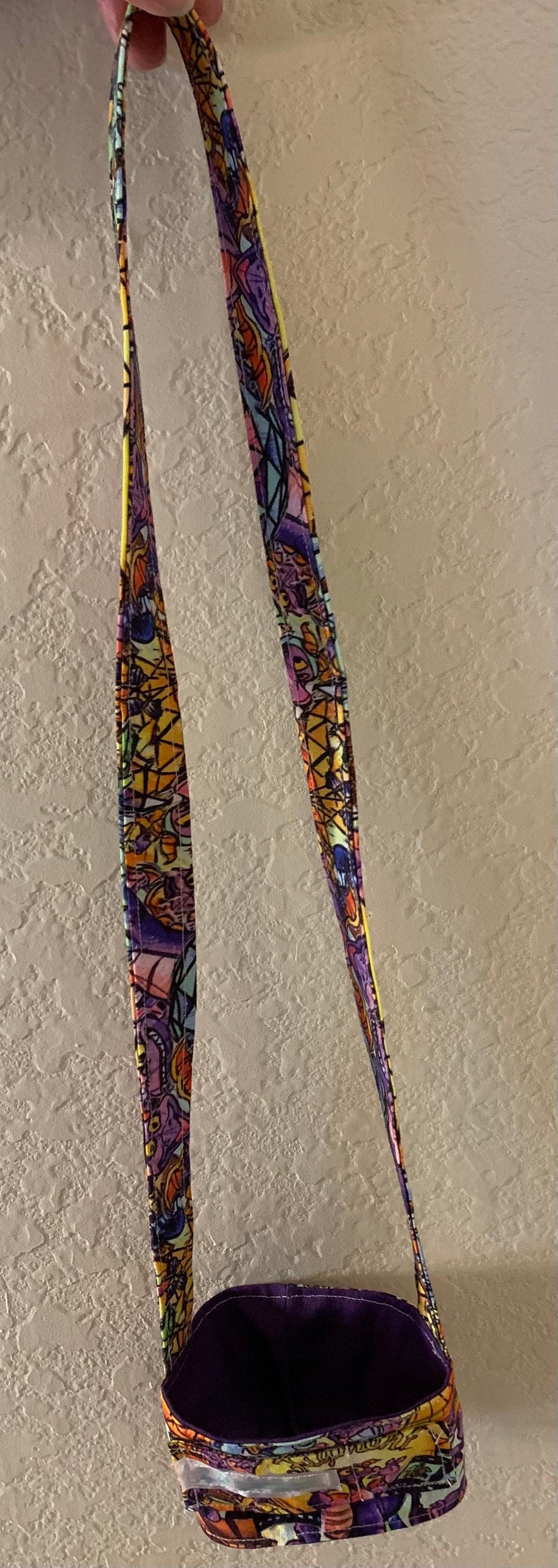 Cup cozy with strap